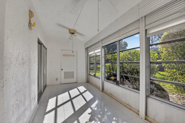 a living room with large lots of furniture and a book shelf