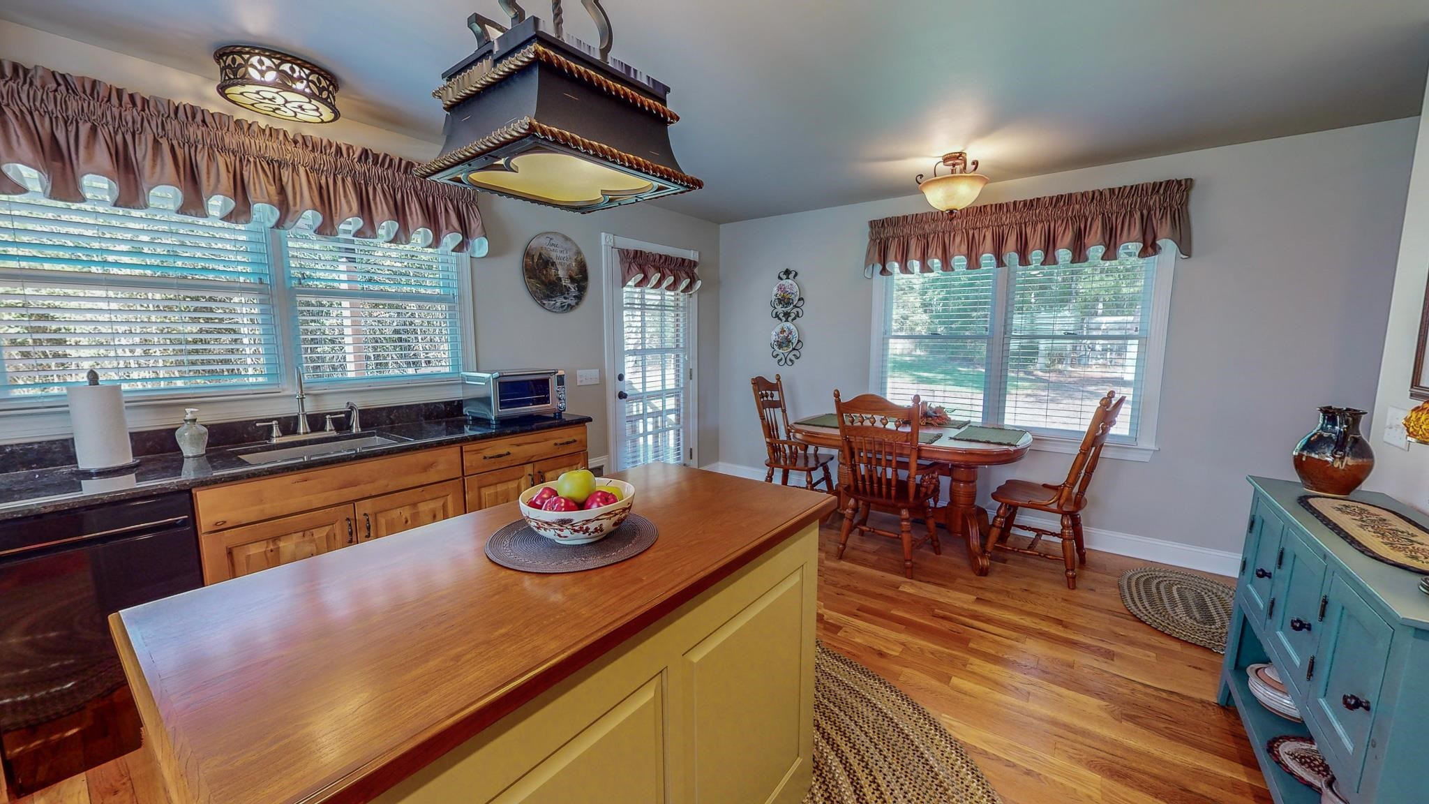 319 Huff Road Roxboro, NC 27574 - Photo 55 of 99 a view of a dining room with furniture window and wooden floor
