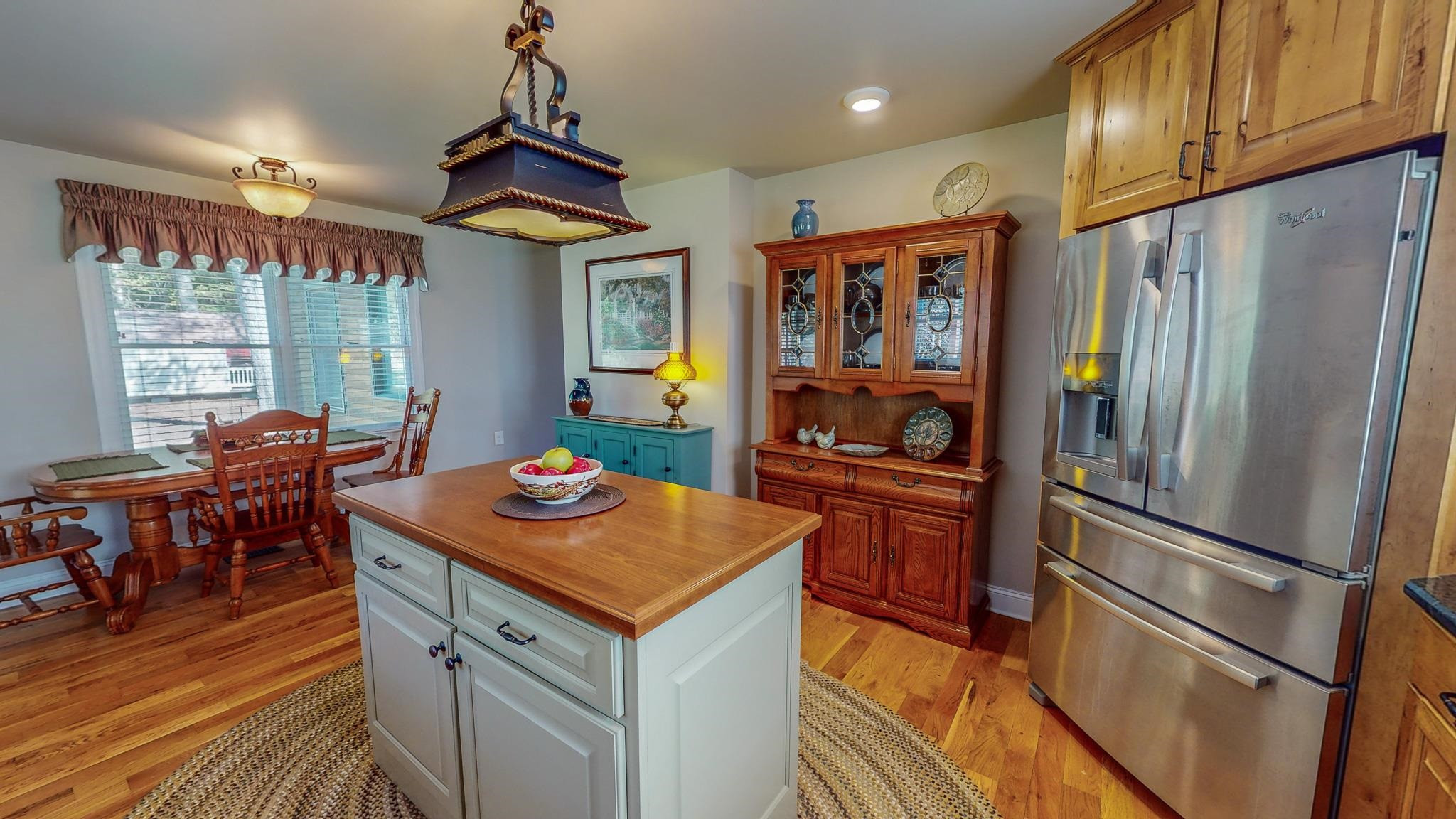 319 Huff Road Roxboro, NC 27574 - Photo 8 of 99 a kitchen with stainless steel appliances granite countertop a refrigerator a stove and a dining table with wooden floor