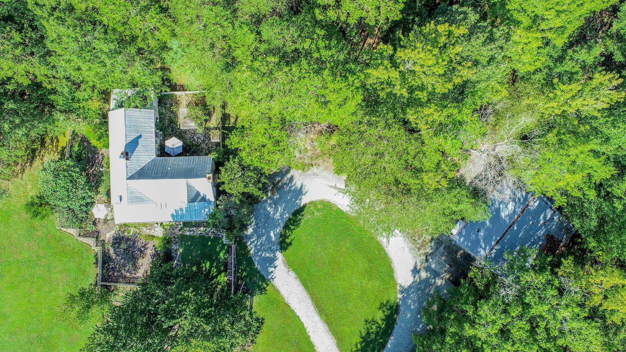 319 Huff Road Roxboro, NC 27574 - Photo 90 of 99 an aerial view of a house with a yard and trees all around