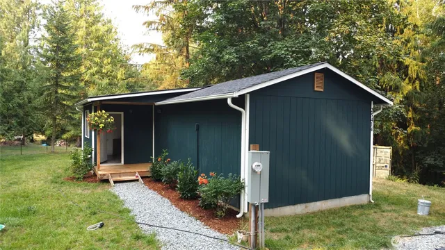 a front view of a house with garden