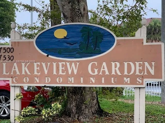 a view of outdoor space with signage and flags