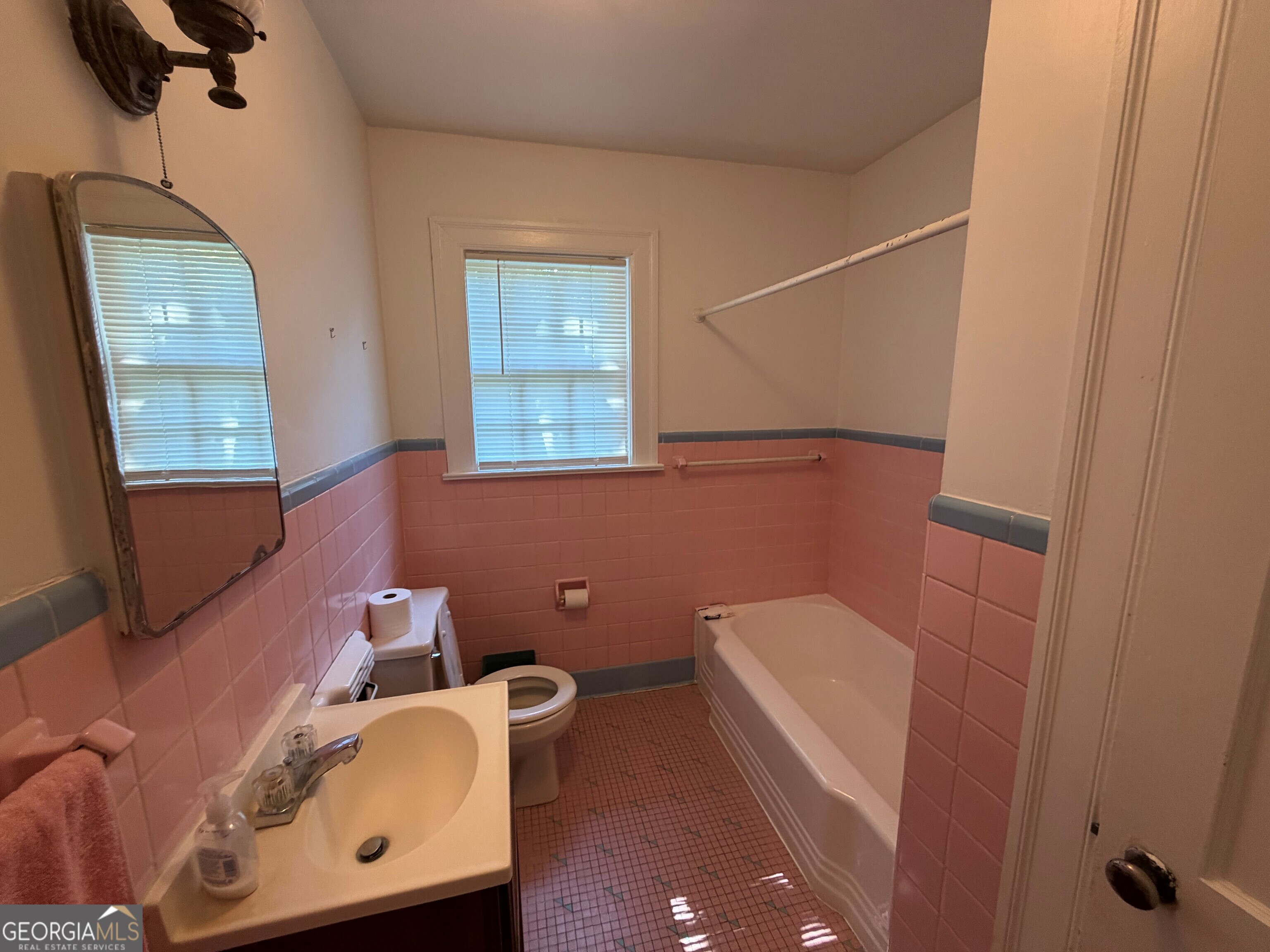 2619 Maple Road Southeast Rome, GA 30161 - Photo 25 of 31 a bathroom with a toilet a sink and mirror