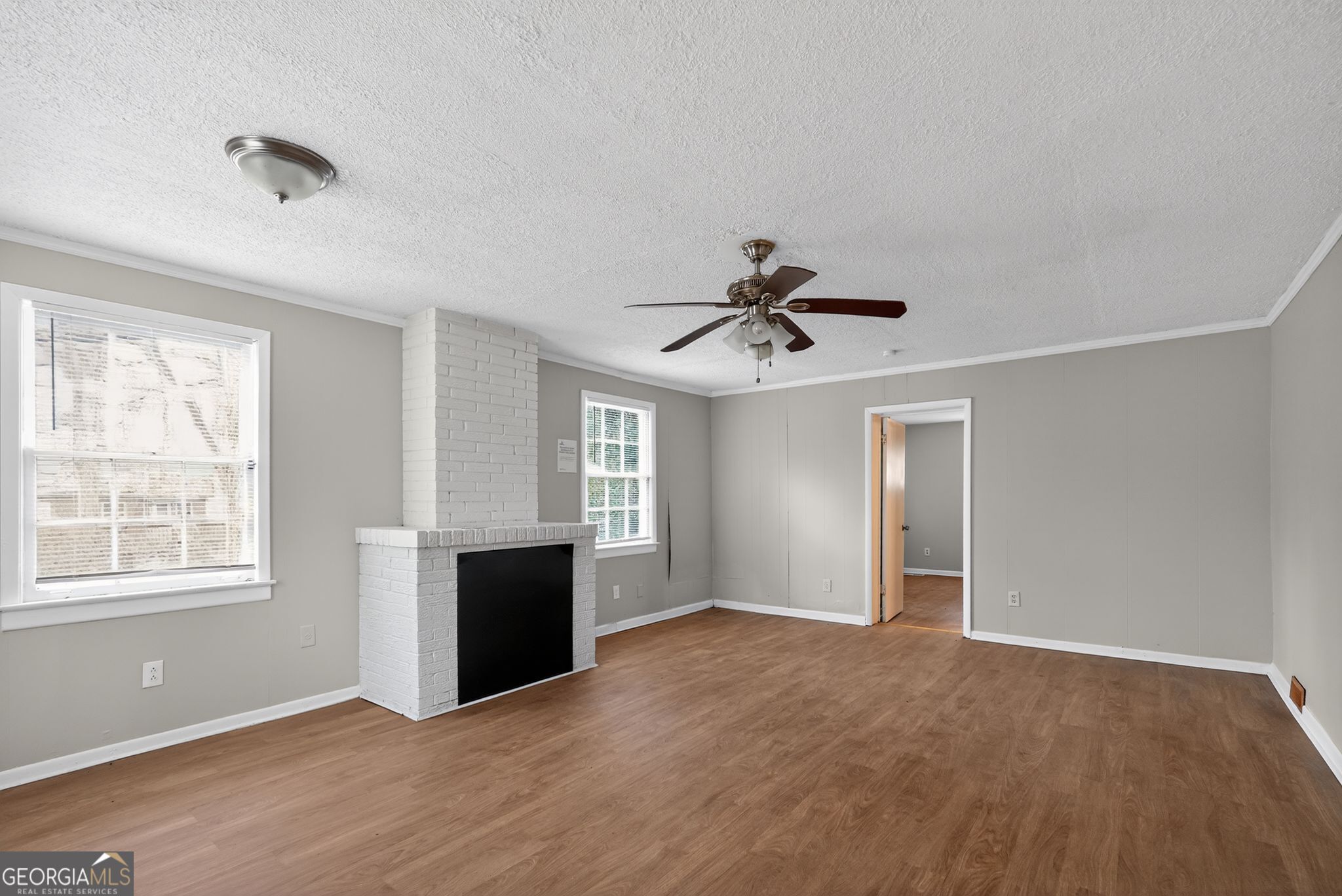 1883 Clarke Lane Decatur, GA 30035 - Photo 18 of 32 a view of a big room with windows and cabinet