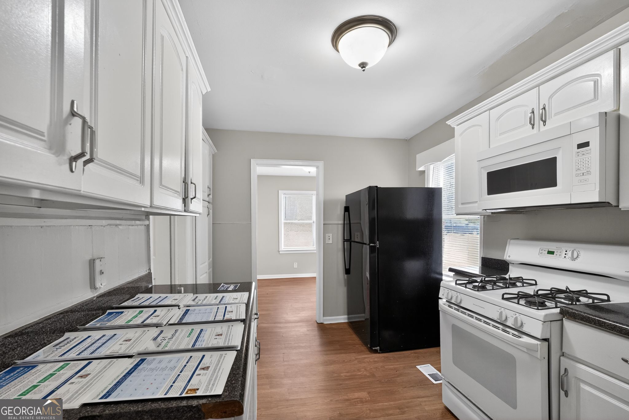 1883 Clarke Lane Decatur, GA 30035 - Photo 19 of 32 a kitchen with stainless steel appliances granite countertop a refrigerator and a stove
