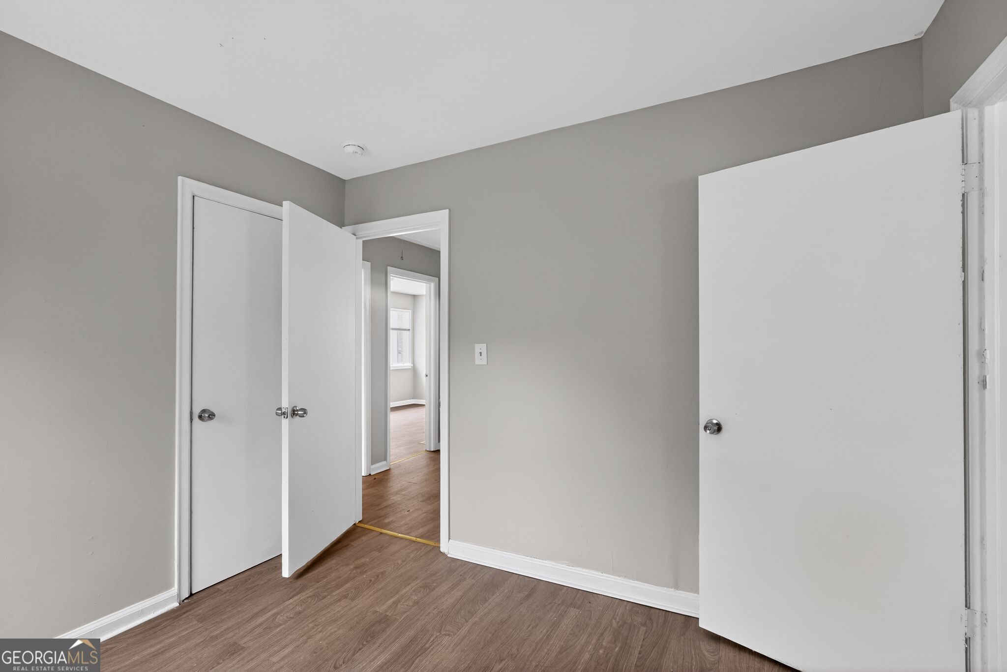 1883 Clarke Lane Decatur, GA 30035 - Photo 25 of 32 a view of an empty room with wooden floor