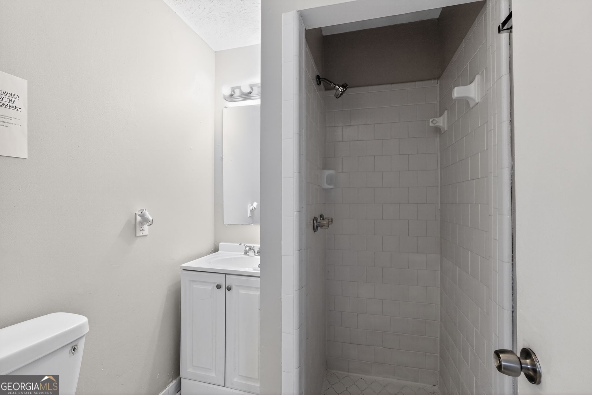 1883 Clarke Lane Decatur, GA 30035 - Photo 28 of 32 a bathroom with a sink toilet and shower