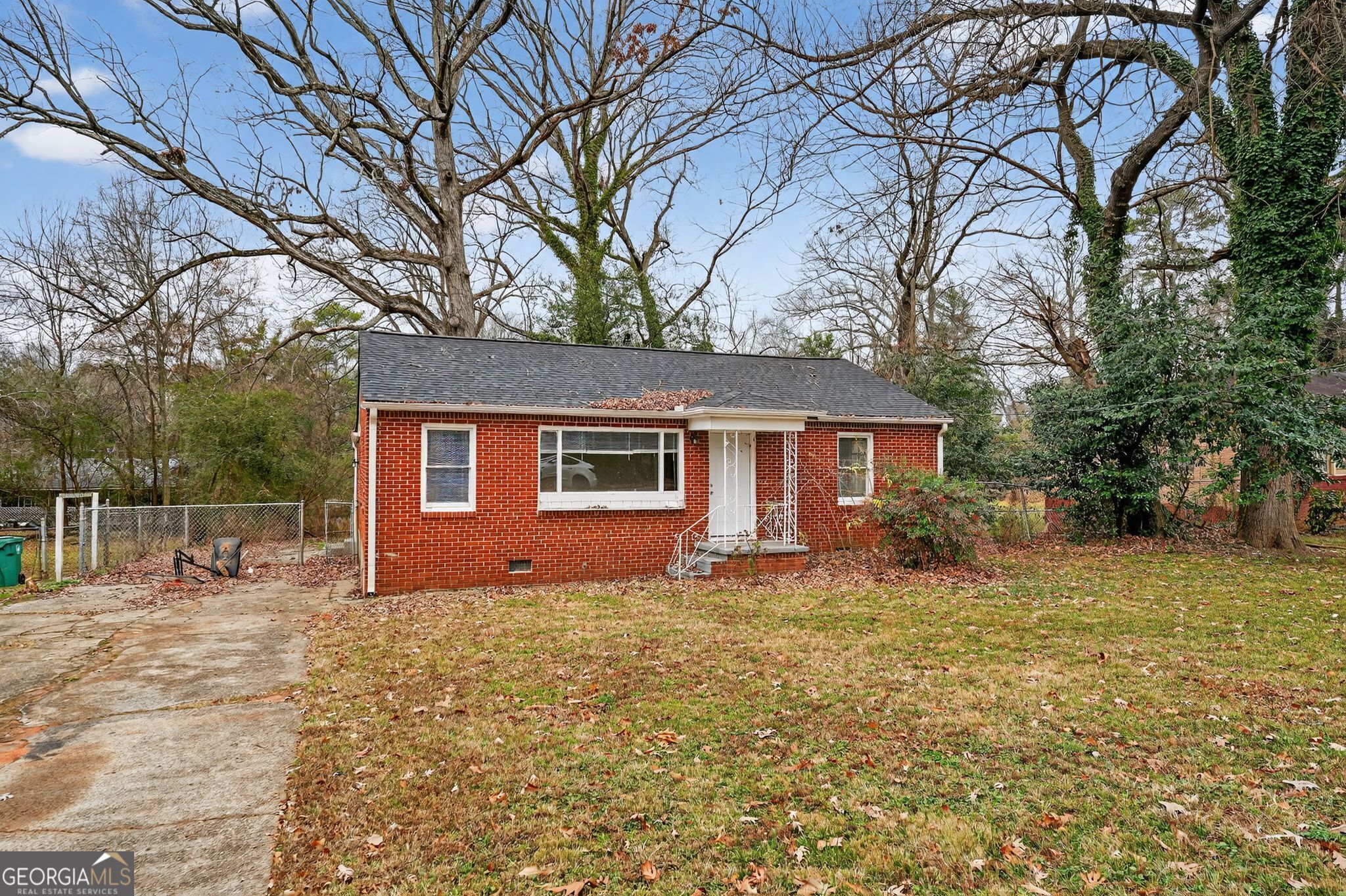1883 Clarke Lane Decatur, GA 30035 - Photo 31 of 32 a front view of a house with a yard