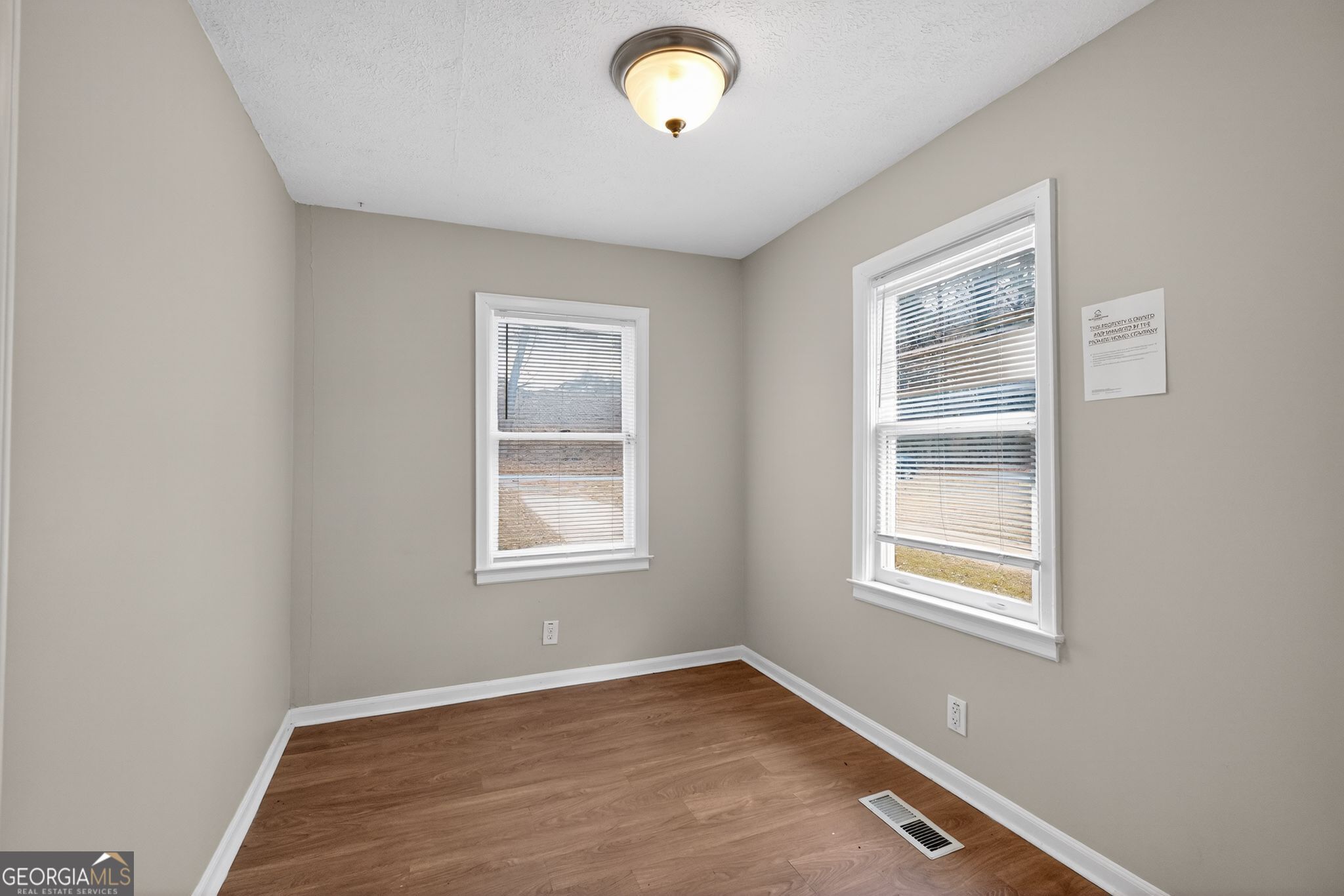 1883 Clarke Lane Decatur, GA 30035 - Photo 7 of 32 an empty room with a window