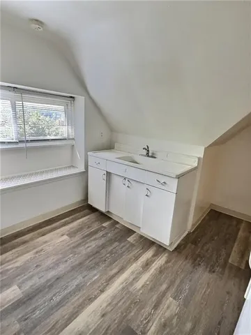 a view of cabinets and wooden floor
