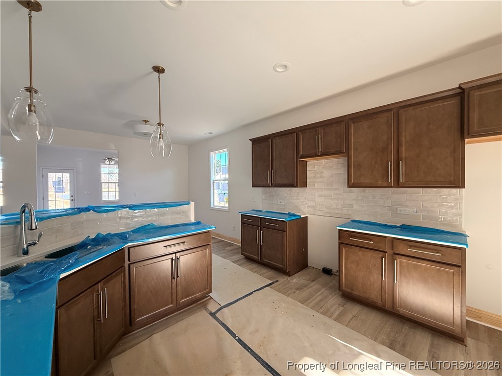 111 Ironbark Drive Raeford, NC 28376 - Photo 8 of 11 a kitchen with stainless steel appliances granite countertop a sink stove and refrigerator