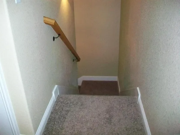 an empty room with wooden floor