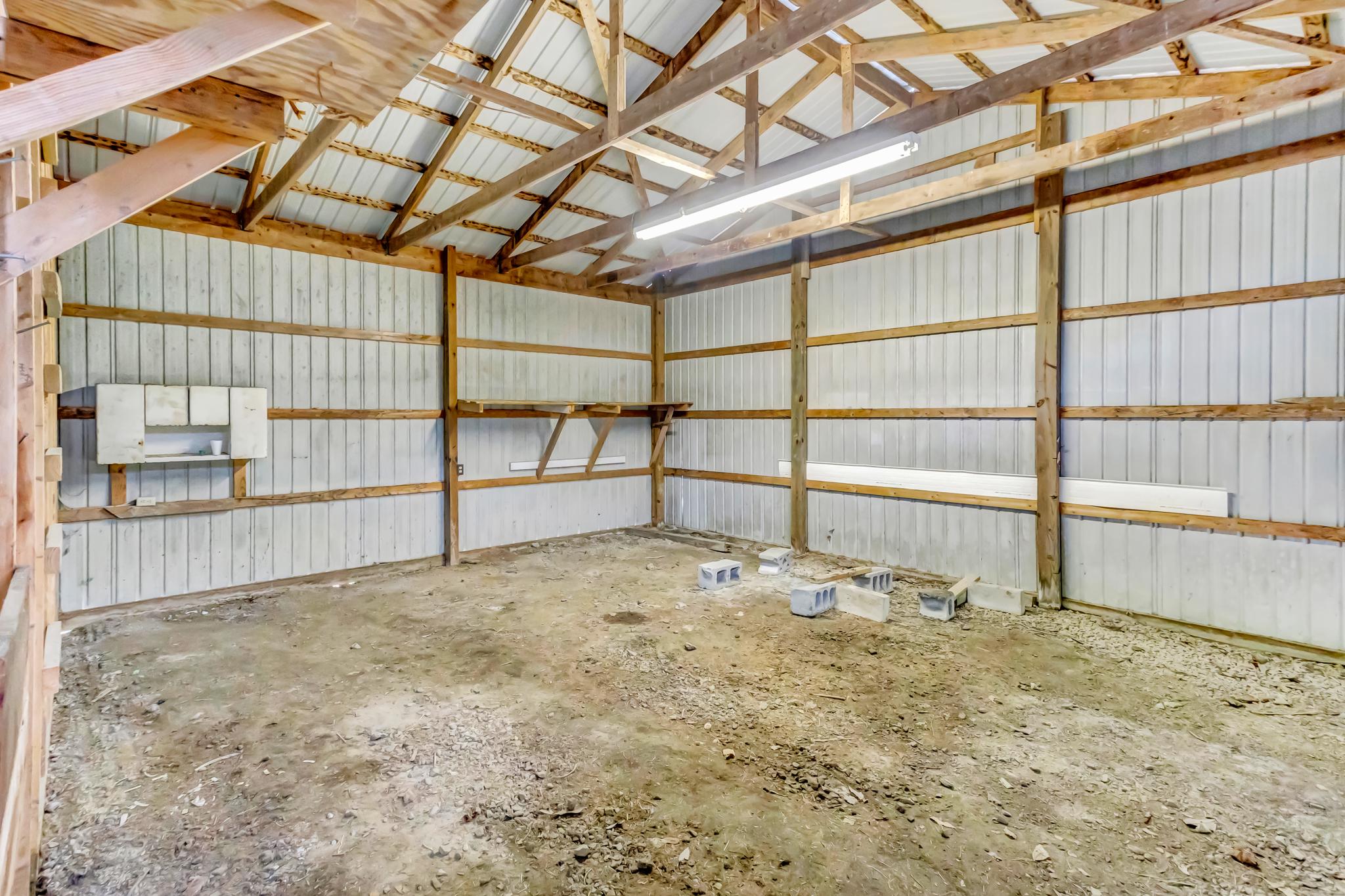 11163 Stewart Neck Road Princess Anne, MD 21853 - Photo 76 of 80 Other half of pole barn w/ sliding barn doors.