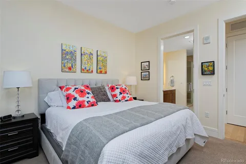 a bedroom with a bed and a couch
