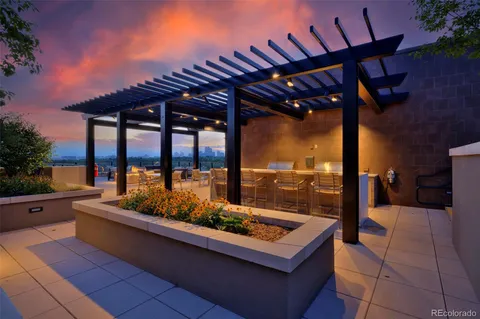 a view of a patio with a table and chairs