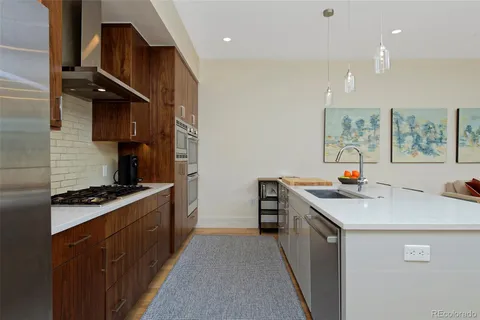 a kitchen with a stove and a sink
