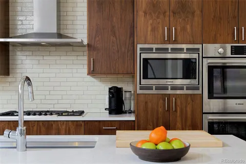 a kitchen with a stove and a microwave