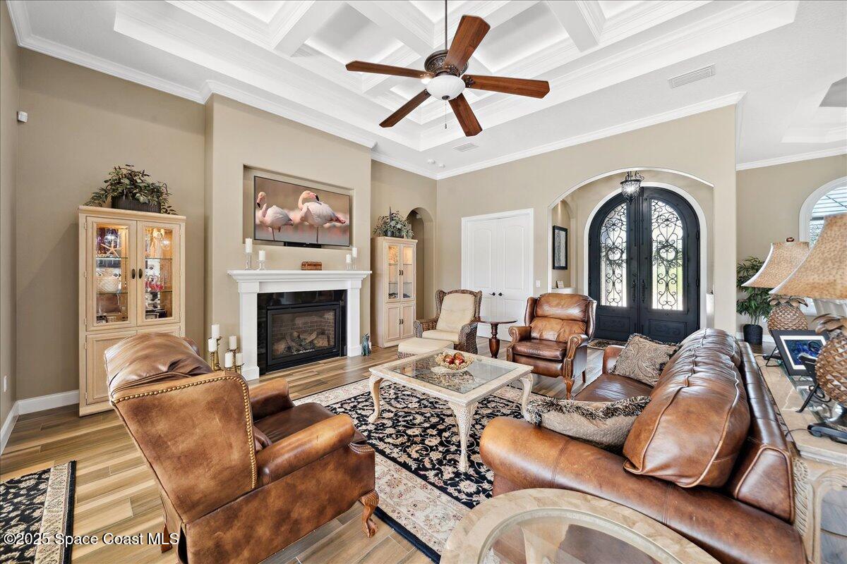 4464 Preservation Circle Melbourne, FL 32934 - Photo 16 of 65 a living room with furniture fireplace and a large window