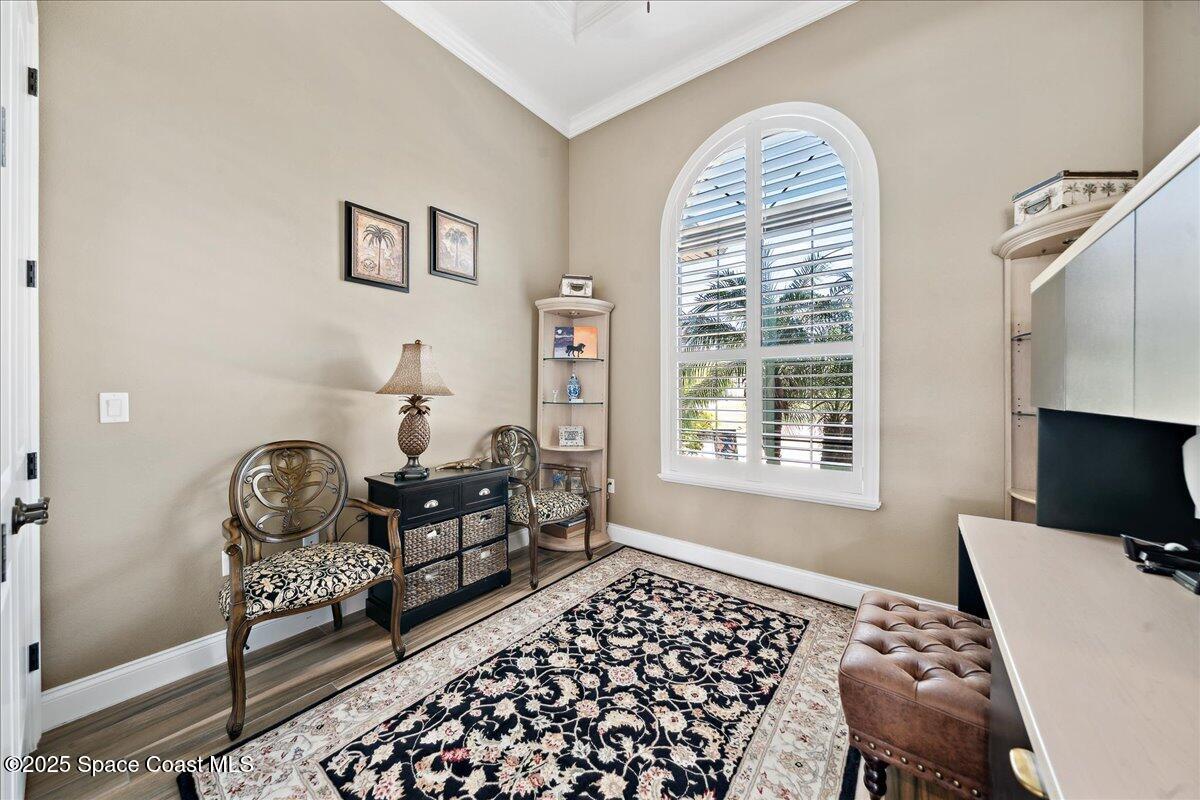 4464 Preservation Circle Melbourne, FL 32934 - Photo 27 of 65 a bedroom with furniture and a window