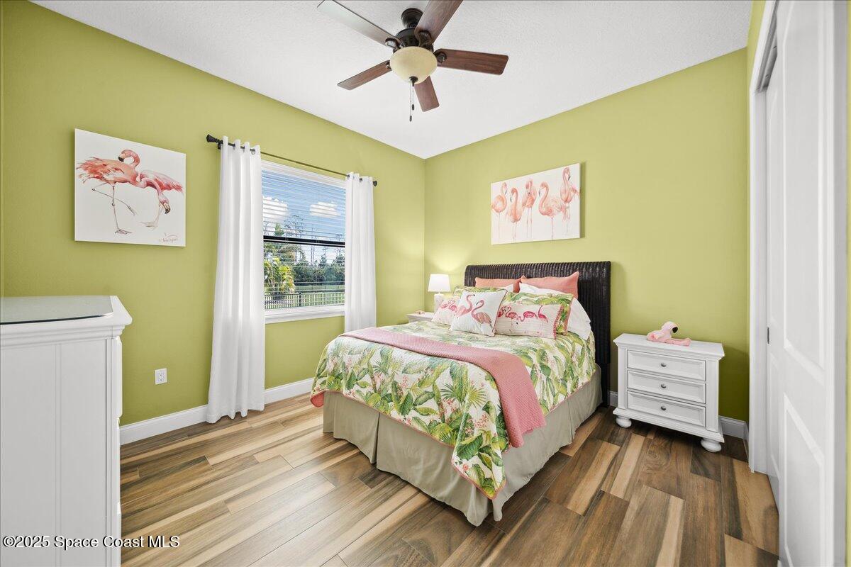 4464 Preservation Circle Melbourne, FL 32934 - Photo 33 of 65 a bedroom with a bed and a window