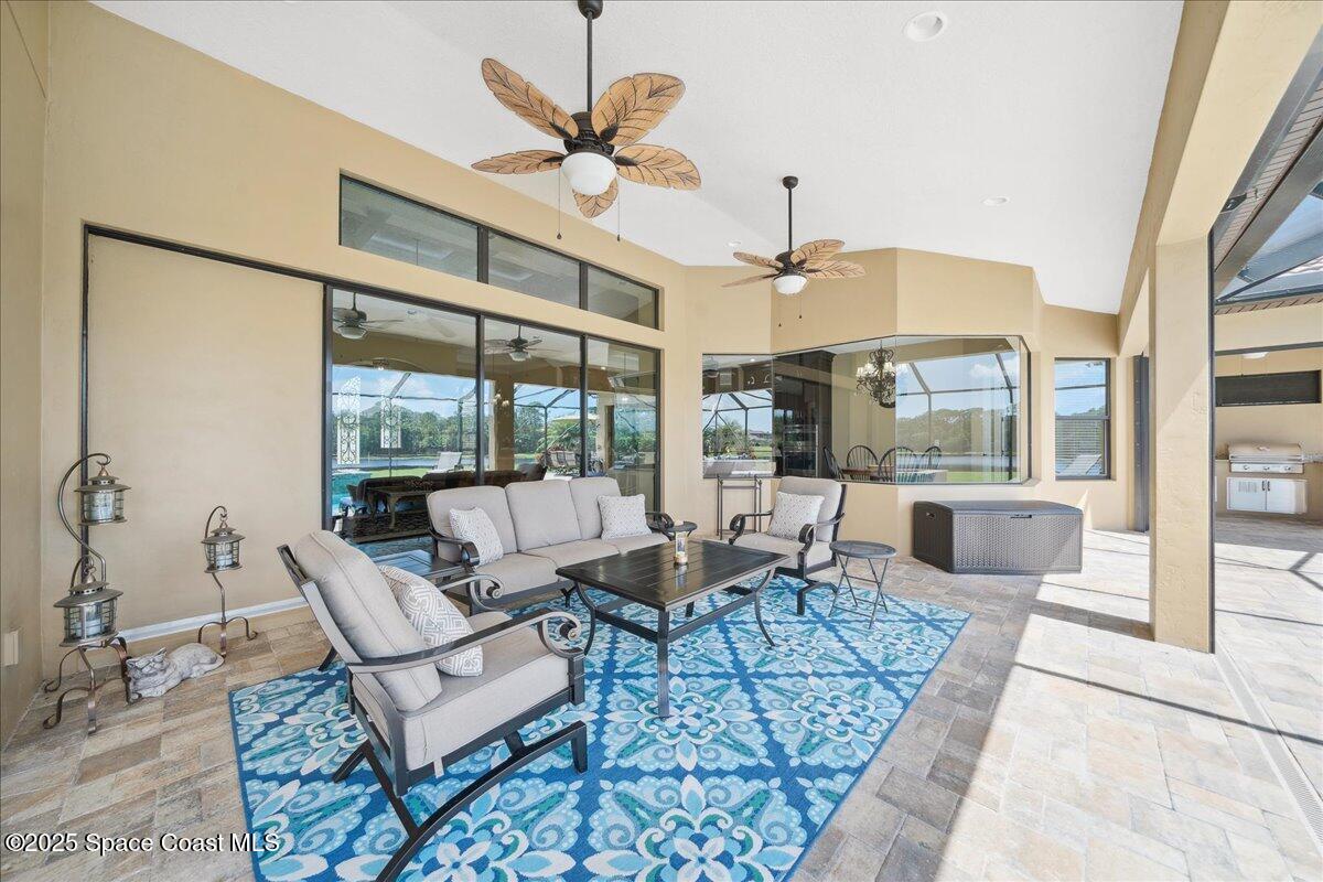 4464 Preservation Circle Melbourne, FL 32934 - Photo 42 of 65 a living room with furniture and a large window