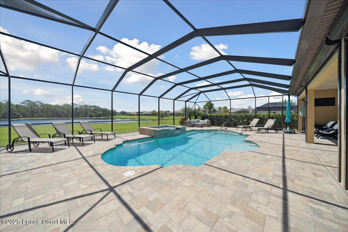 4464 Preservation Circle Melbourne, FL 32934 - Photo 45 of 65 a view of a swimming pool with a patio