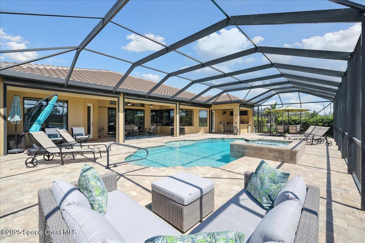 4464 Preservation Circle Melbourne, FL 32934 - Photo 46 of 65 a view of a patio with couches chairs and potted plants