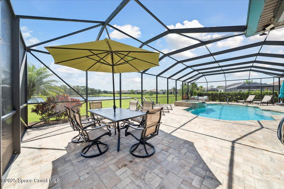 4464 Preservation Circle Melbourne, FL 32934 - Photo 47 of 65 a view of a swimming pool with a patio