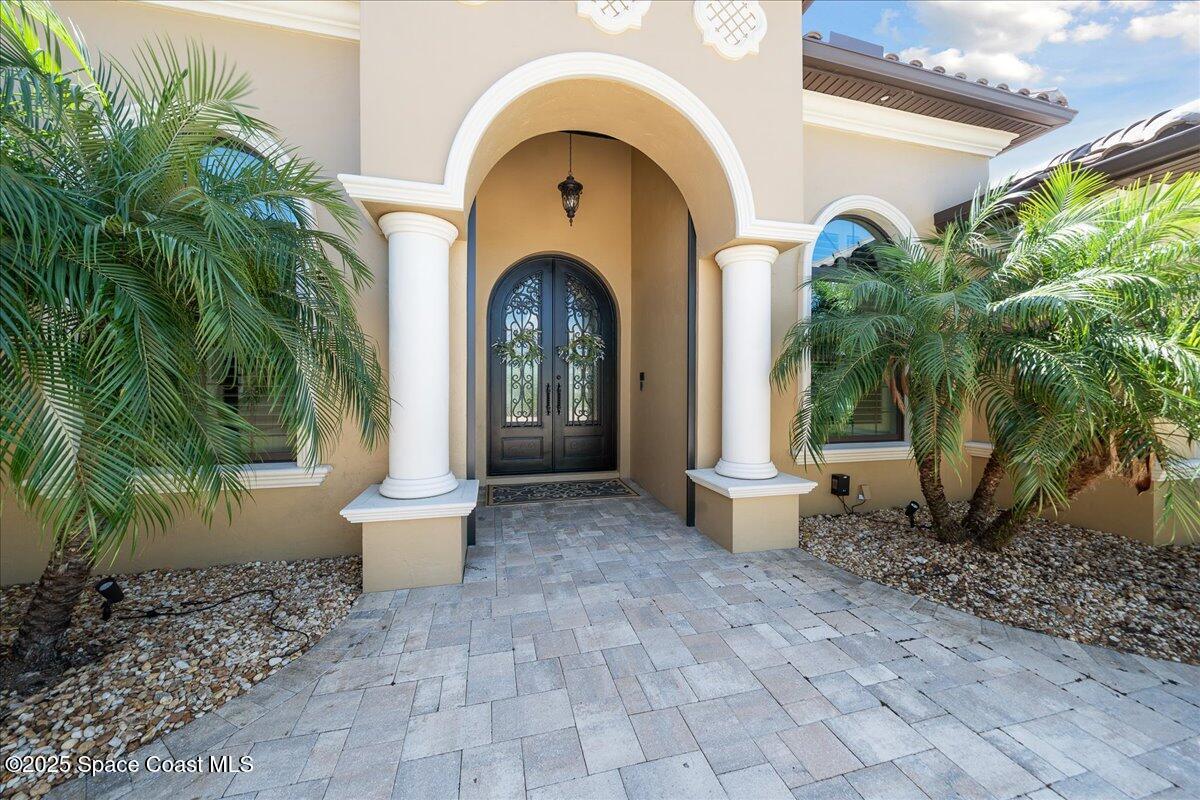 4464 Preservation Circle Melbourne, FL 32934 - Photo 53 of 65 a front view of a house with garden