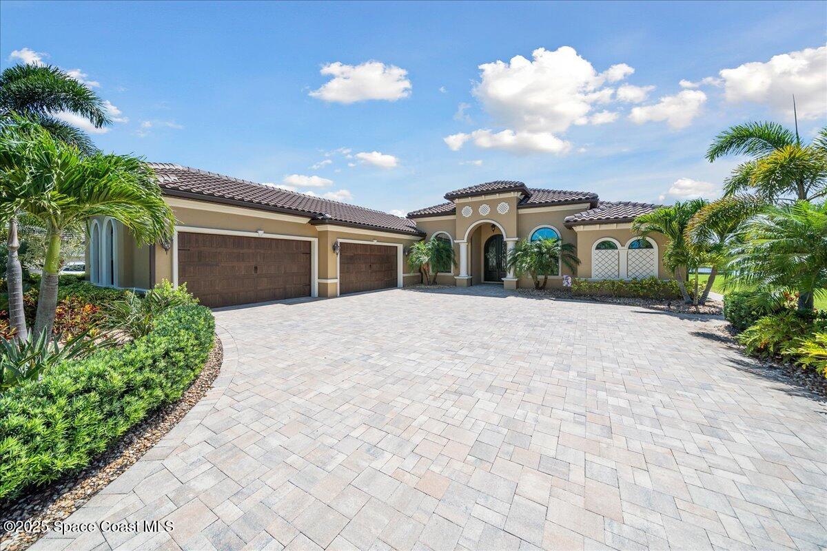 4464 Preservation Circle Melbourne, FL 32934 - Photo 6 of 65 a view of a house with a yard and potted plants