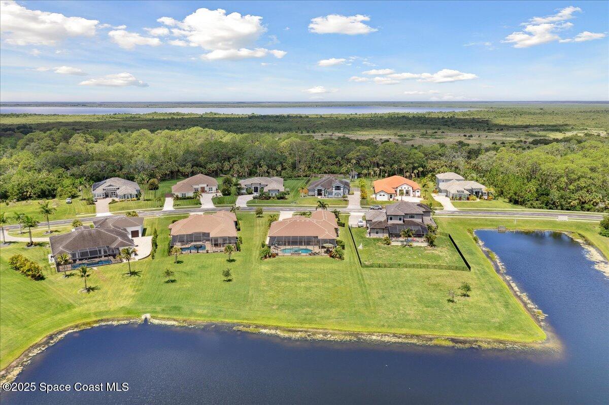 4464 Preservation Circle Melbourne, FL 32934 - Photo 61 of 65 a view of a swimming pool with an ocean