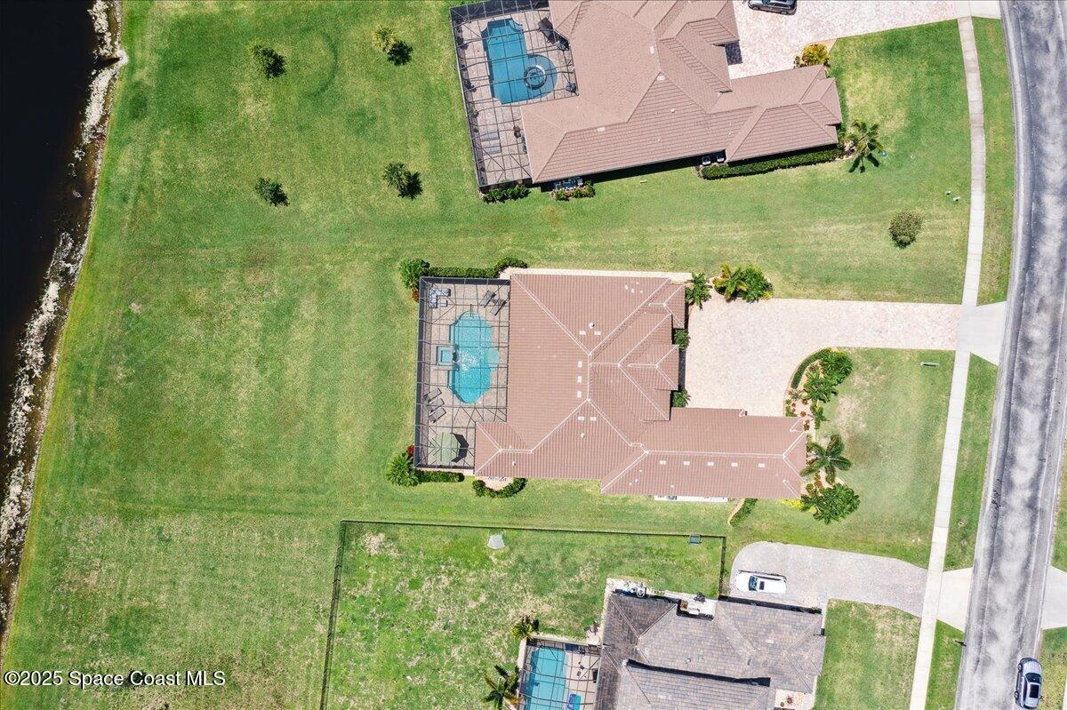 4464 Preservation Circle Melbourne, FL 32934 - Photo 63 of 65 an aerial view of a house with a garden