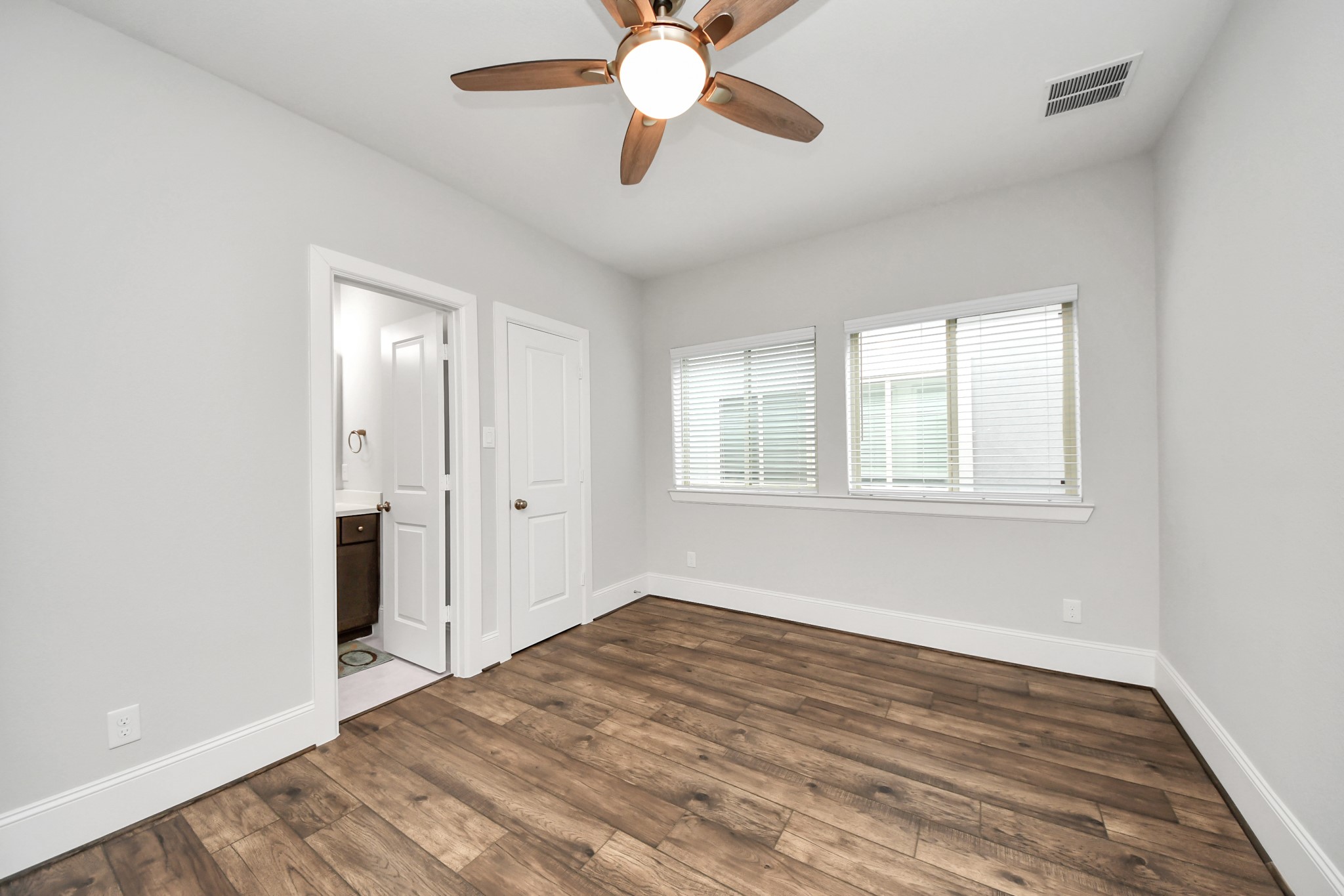8609 Concord Trace Houston, TX 77055 - Photo 34 of 50 a view of an empty room with window and wooden floor