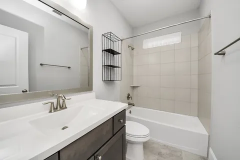 a view of a backyard with wooden fence