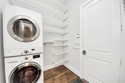 a view of a hallway with washer and dryer