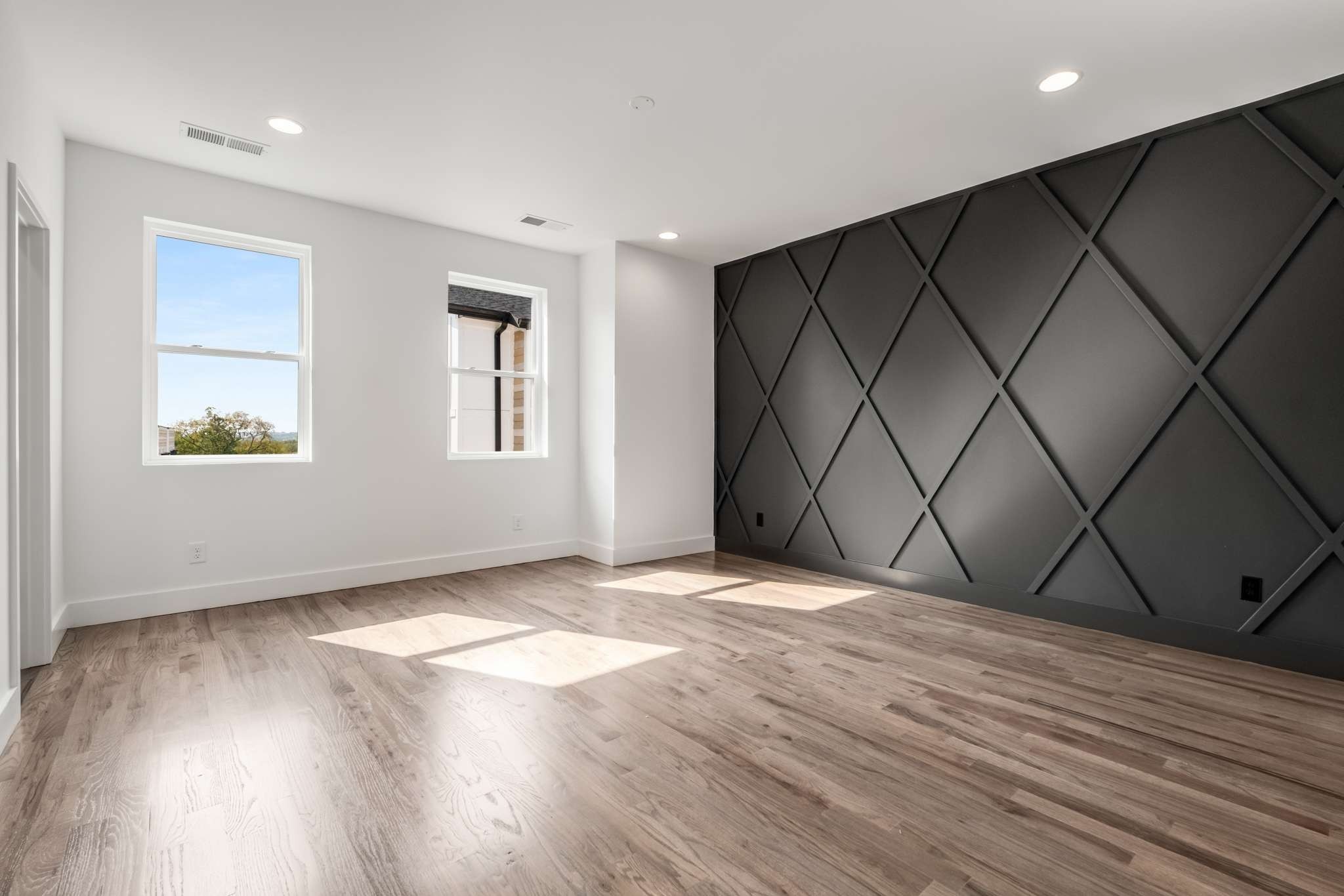 1806 Lischey Avenue, Unit 3 Nashville, TN 37207 - Photo 14 of 25 an empty room with wooden floor and windows