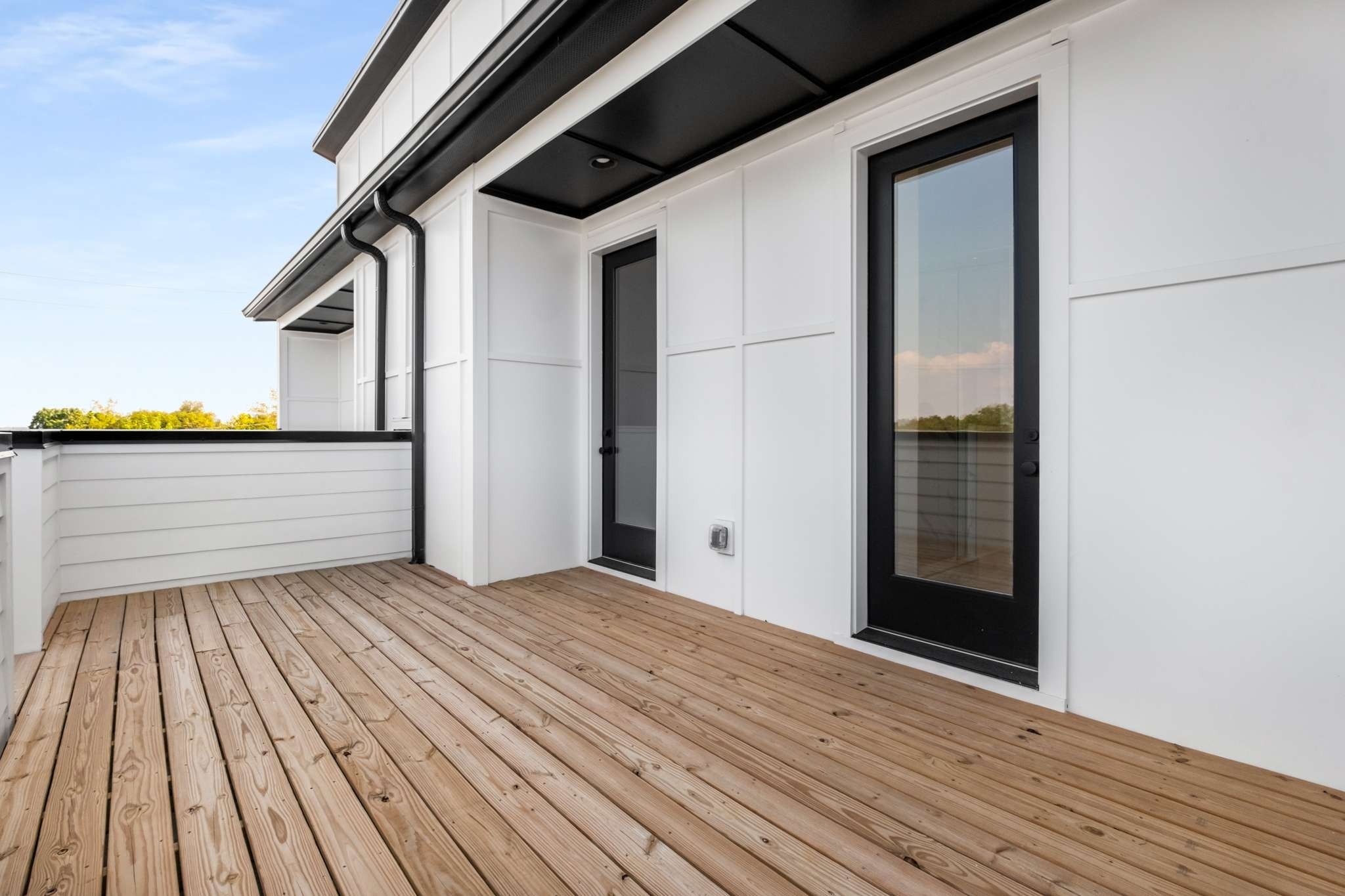 1806 Lischey Avenue, Unit 3 Nashville, TN 37207 - Photo 2 of 25 a view of a balcony with wooden floor and fence