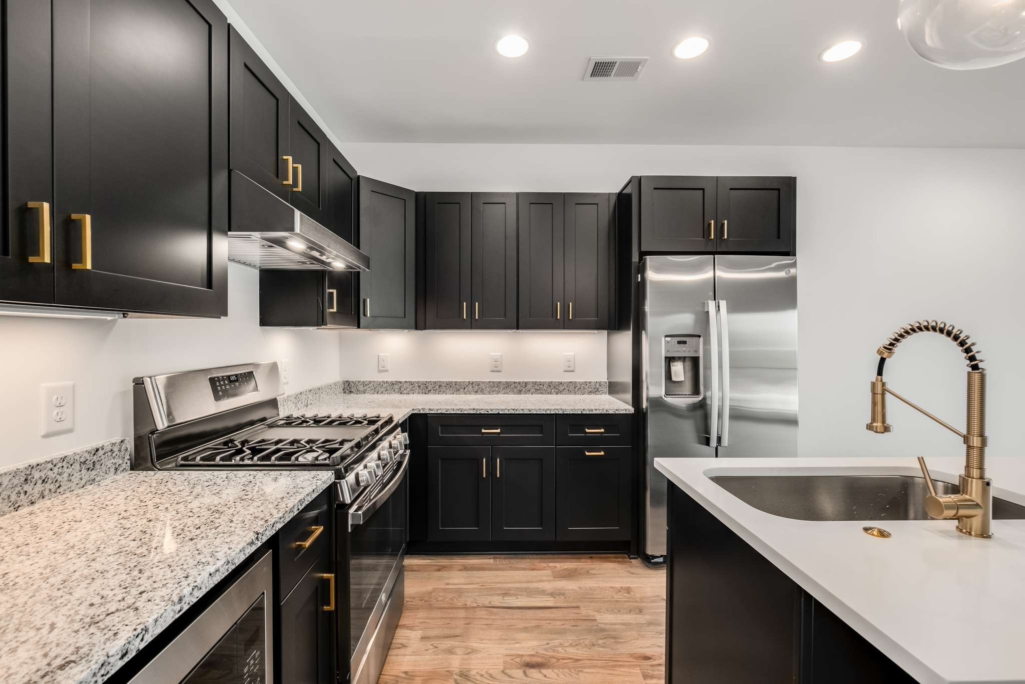 1806 Lischey Avenue, Unit 3 Nashville, TN 37207 - Photo 5 of 25 a kitchen with stainless steel appliances granite countertop a sink stove and refrigerator