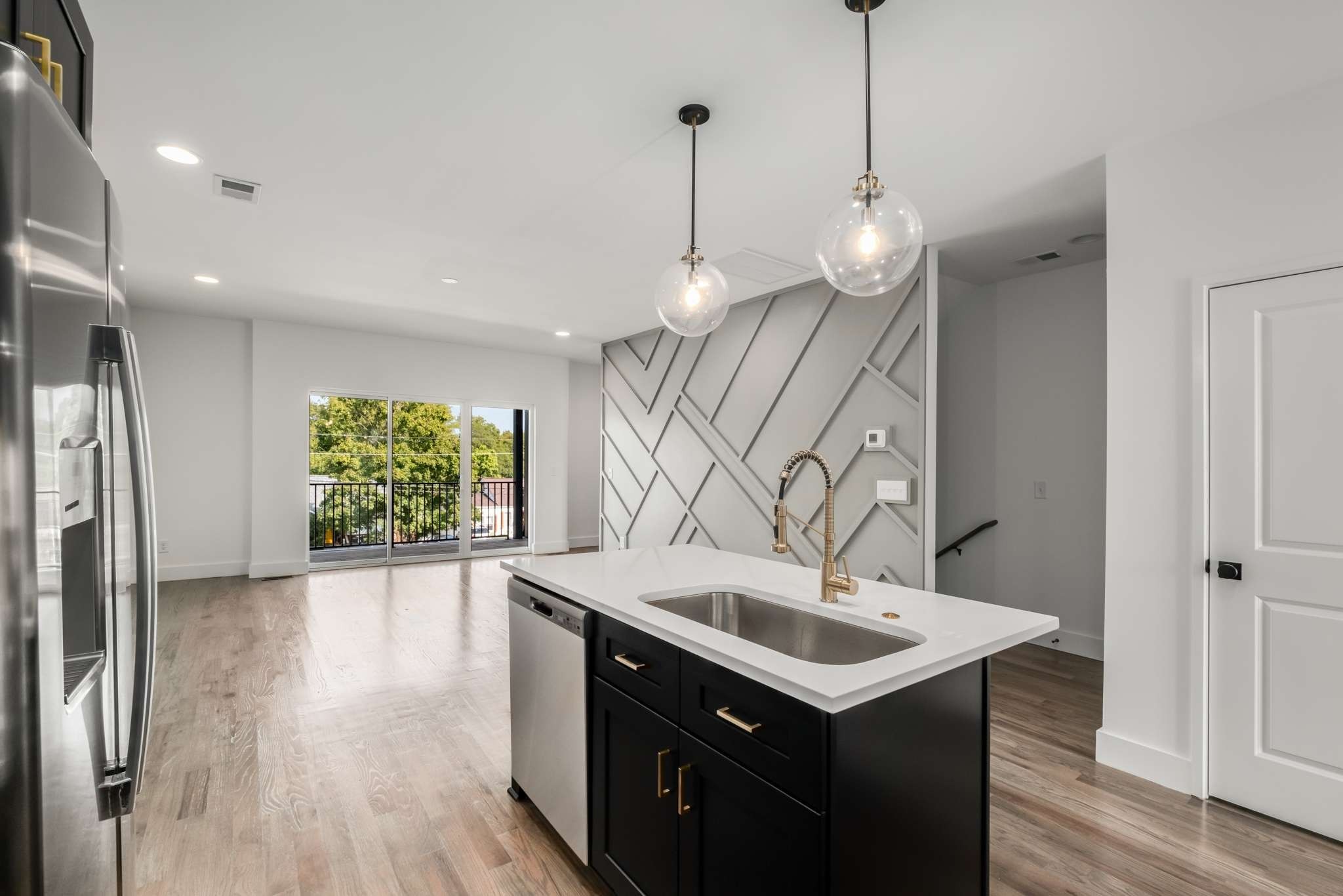 1806 Lischey Avenue, Unit 3 Nashville, TN 37207 - Photo 6 of 25 a kitchen with a sink center island and a wooden floor