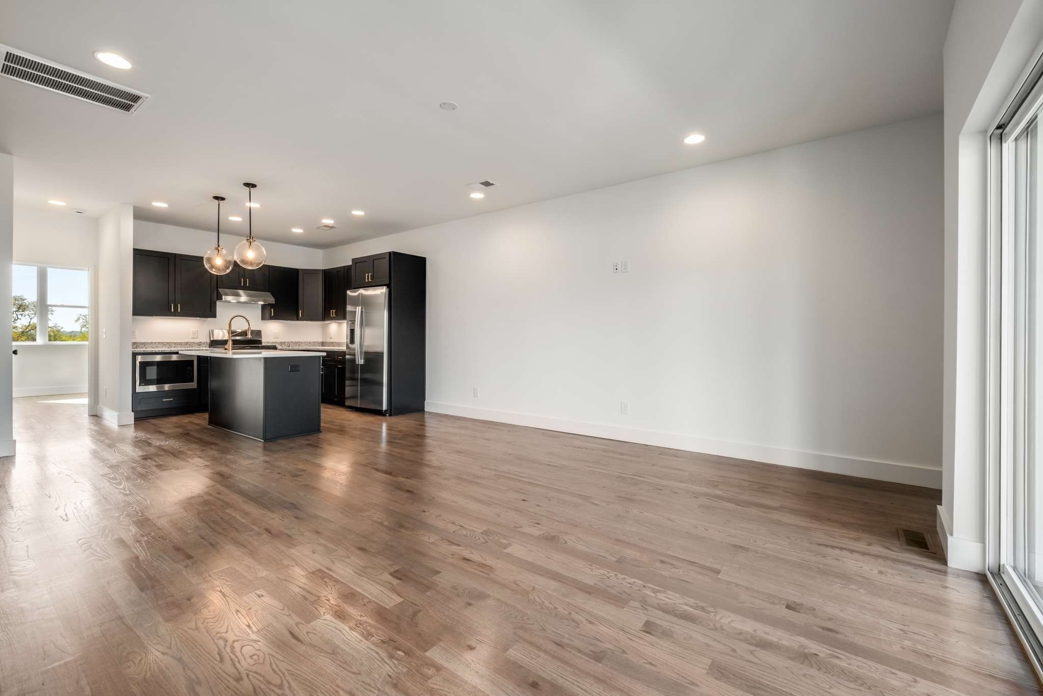 1806 Lischey Avenue, Unit 3 Nashville, TN 37207 - Photo 8 of 25 an open kitchen with a sink and stainless steel appliances