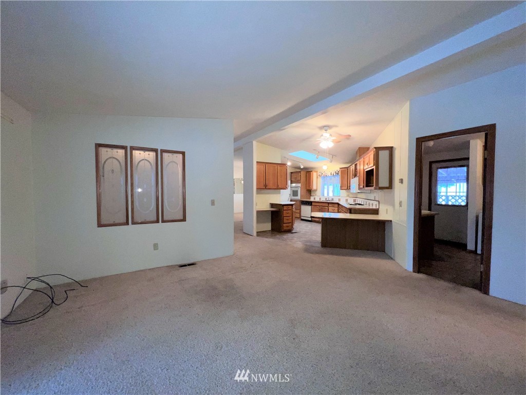 1009 Fir Loop Republic, WA 99166 - Photo 11 of 30 a view of an empty room with a kitchen