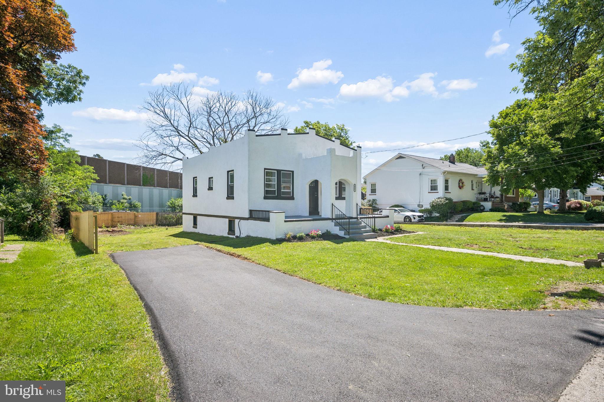 517 Valcour Road Baltimore, MD 21228 - Photo 6 of 47 a front view of a house with swimming pool yard and outdoor seating