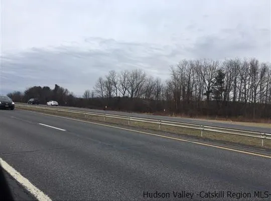 a view of street with parked cars