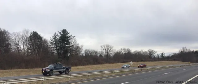 a view of a house and a yard