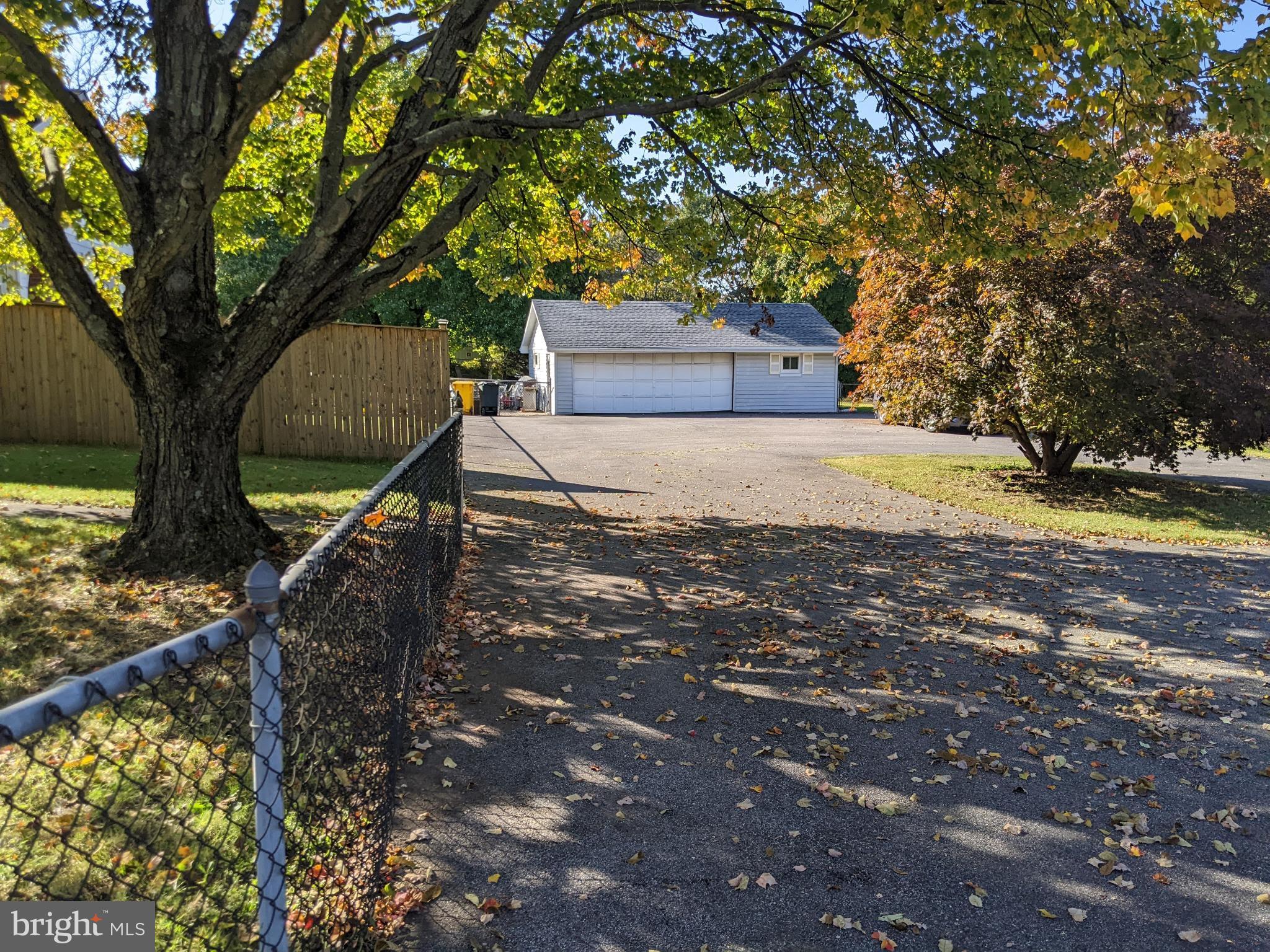 7836 Clark Station Road Severn, MD 21144 - Photo 29 of 31 Huge driveway and 2 car garage with workshop!