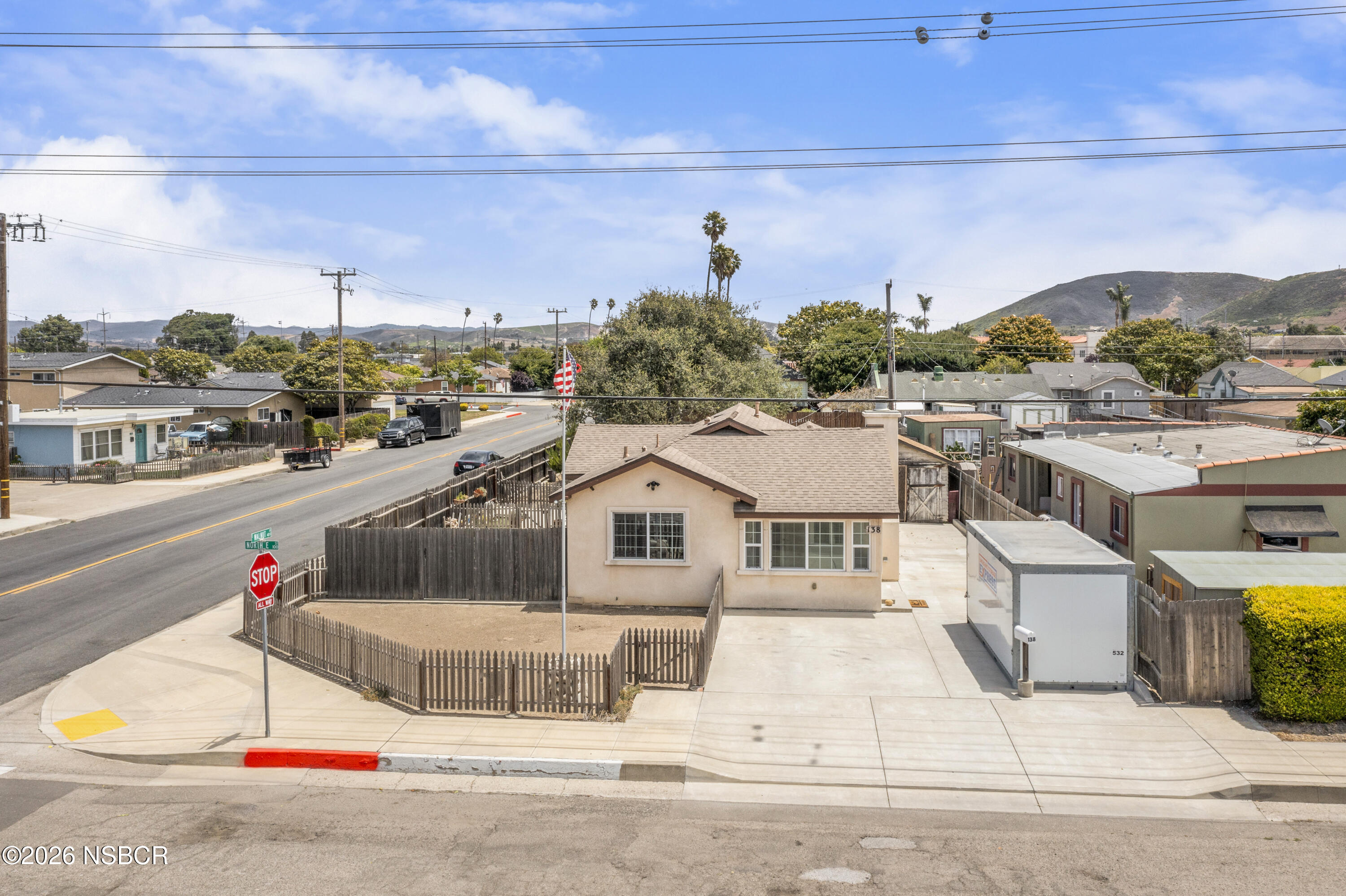 138 North E Street Lompoc, CA 93436 - Photo 2 of 35 a view of a terrace with a couch and potted plants