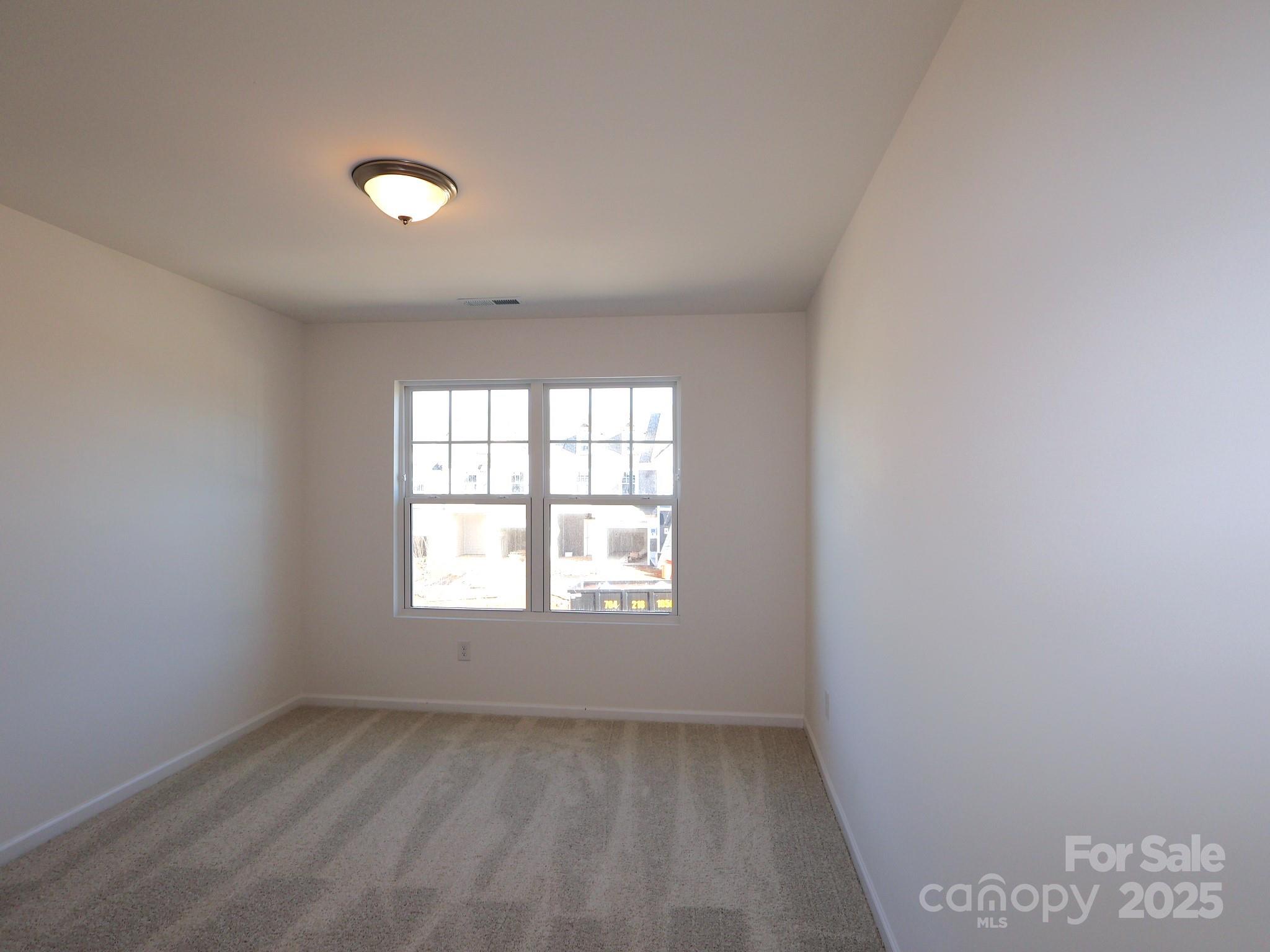 776 Kitfox Drive Northwest Concord, NC 28027 - Photo 7 of 12 an empty room with a window