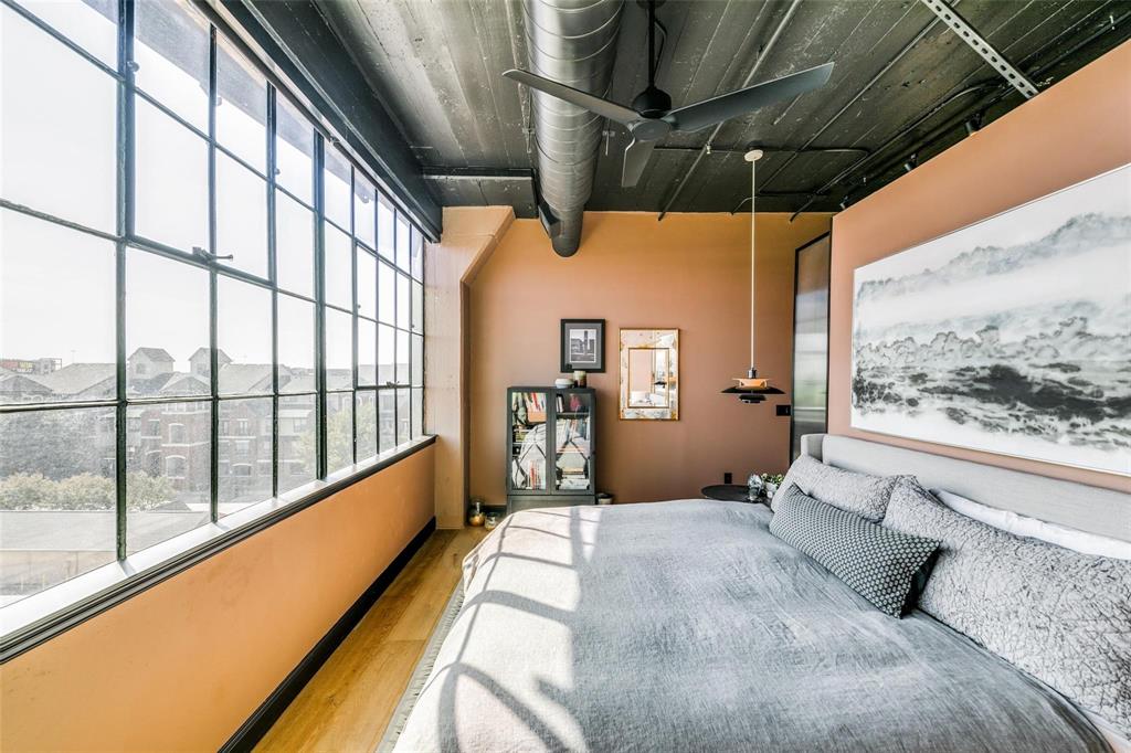 2220 Canton Street, Unit 406 Dallas, TX 75201 - Photo 11 of 22 a bedroom with a bed and large windows