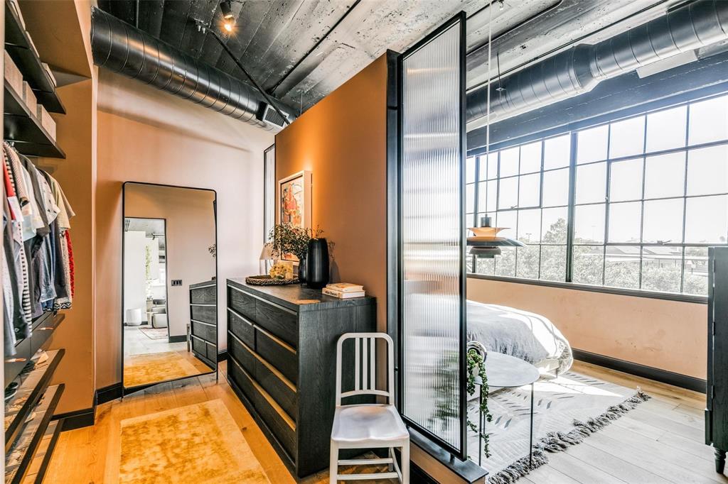 2220 Canton Street, Unit 406 Dallas, TX 75201 - Photo 13 of 22 a kitchen with stainless steel appliances granite countertop a stove a refrigerator and a dining table