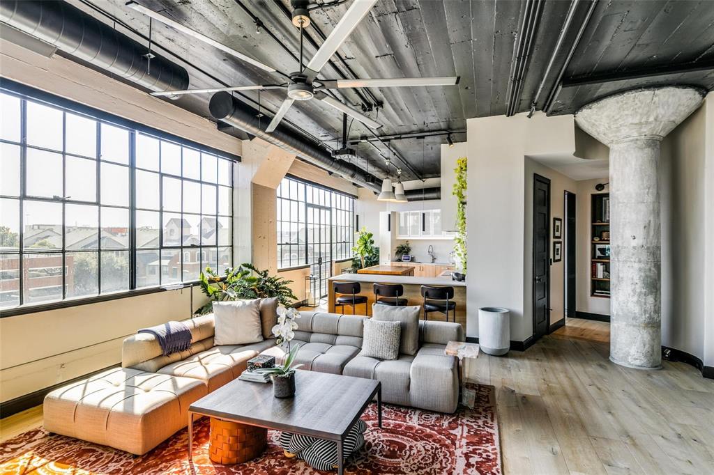 2220 Canton Street, Unit 406 Dallas, TX 75201 - Photo 14 of 22 a living room with furniture and a large window